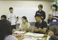  「Teams at a camp held to develop local businesses debate late into the night  